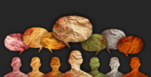 Abstract picture of colourful people and speech bubbles above their head on a black background.