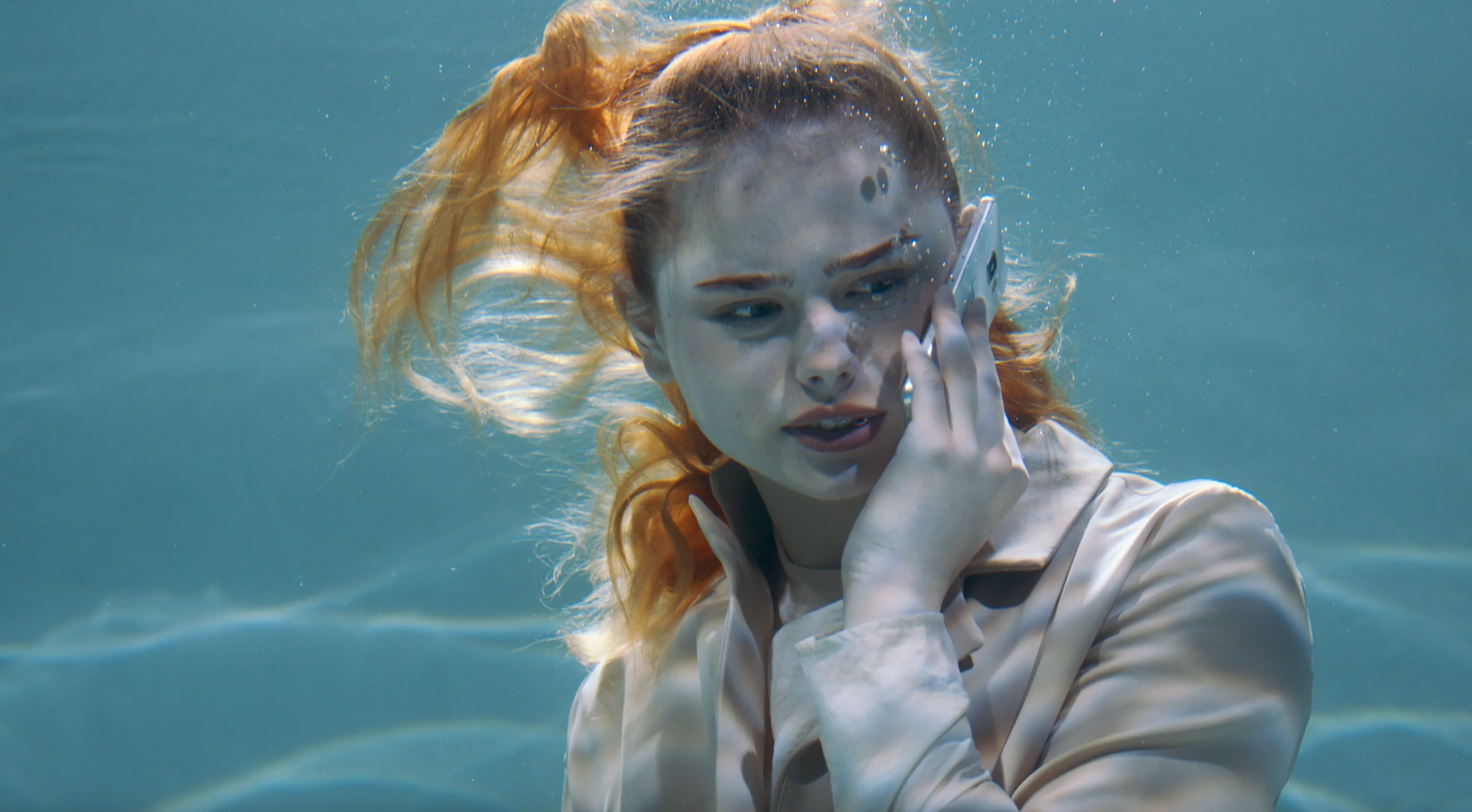Girl talking underwater