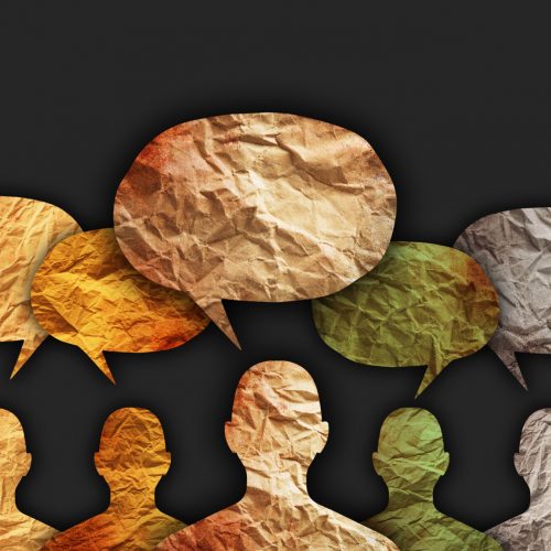 Abstract picture of colourful people and speech bubbles above their head on a black background.