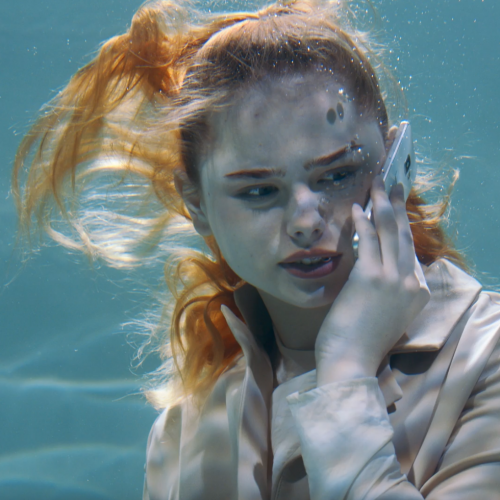 Girl talking underwater